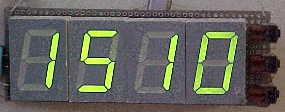 Photograph showing a four 7-segment displays, displaying one, five, one and zero.