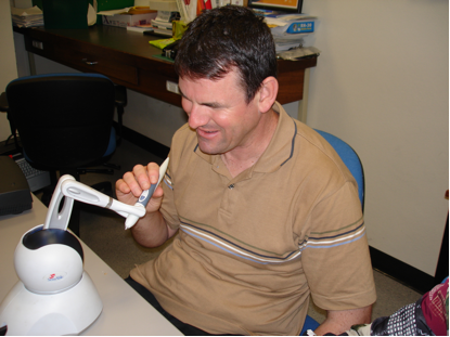 Photograph a man using the Haptic Showcase