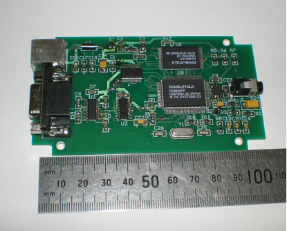 Photograph of singletalk circit board with a ruler showing it to be 100mm long.